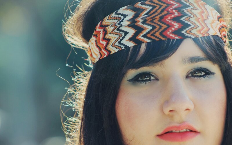 woman with headband and makeup