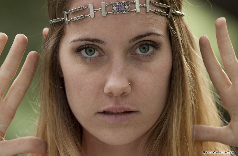 woman with headband and nose piercing