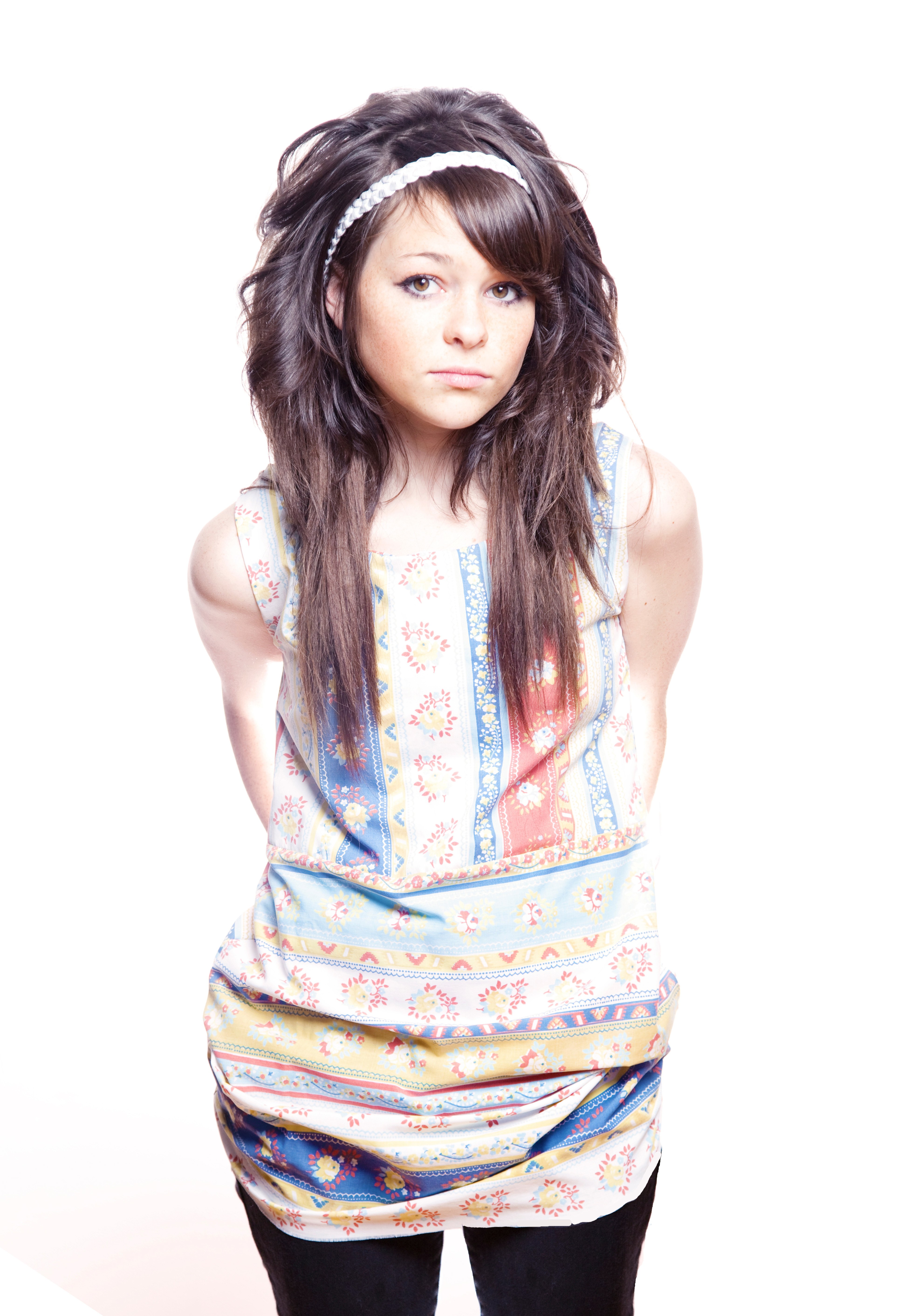 woman with headband and patterned top