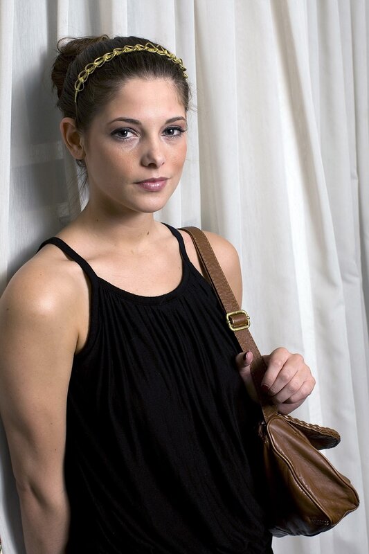 woman with headband and purse