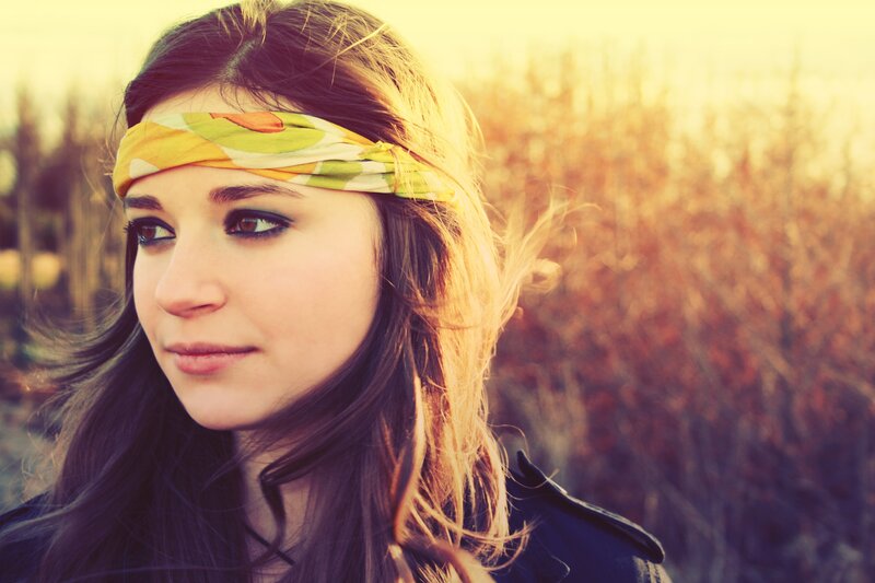 woman with headband in field