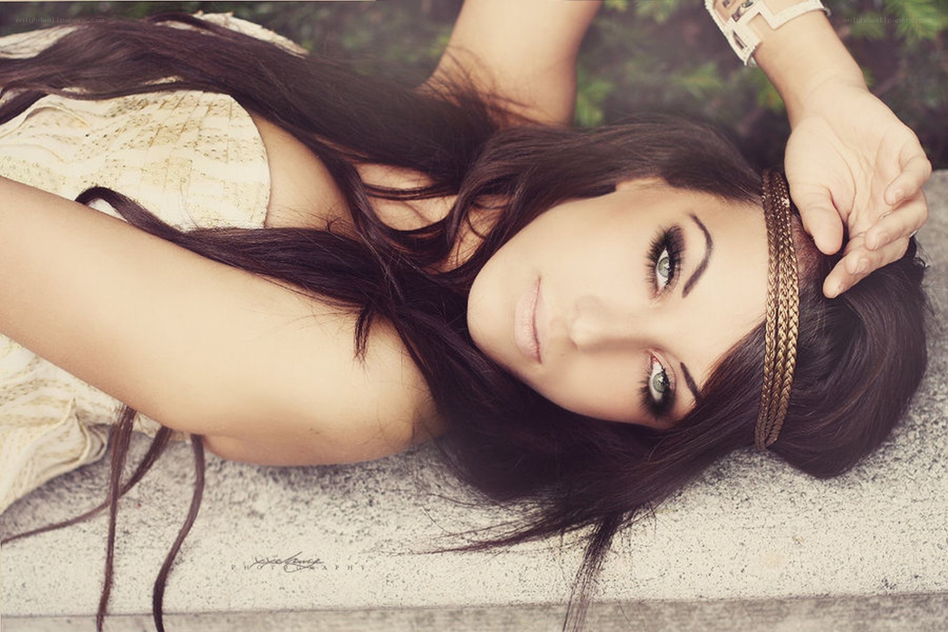 woman with headband lying down