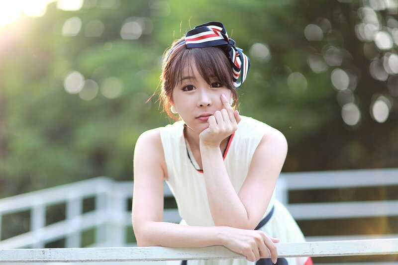 woman with headband on bridge