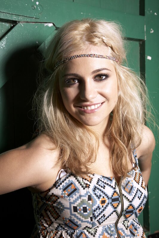 woman with headband smiling
