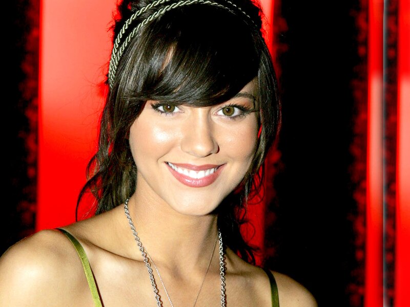 woman with headband smiling