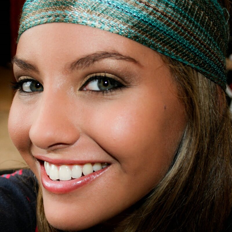 woman with headband smiling