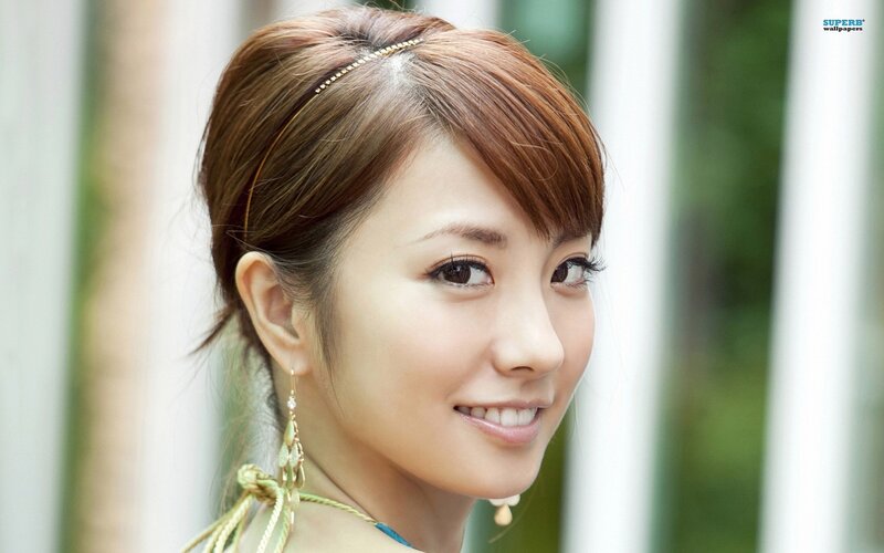 woman with headband smiling