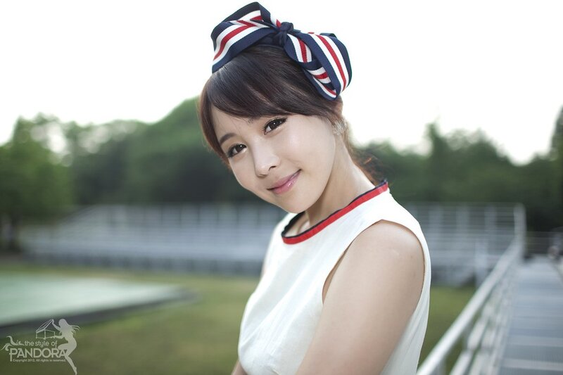 woman with headband smiling