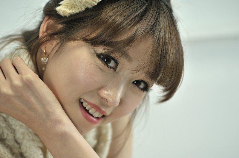 woman with headband smiling