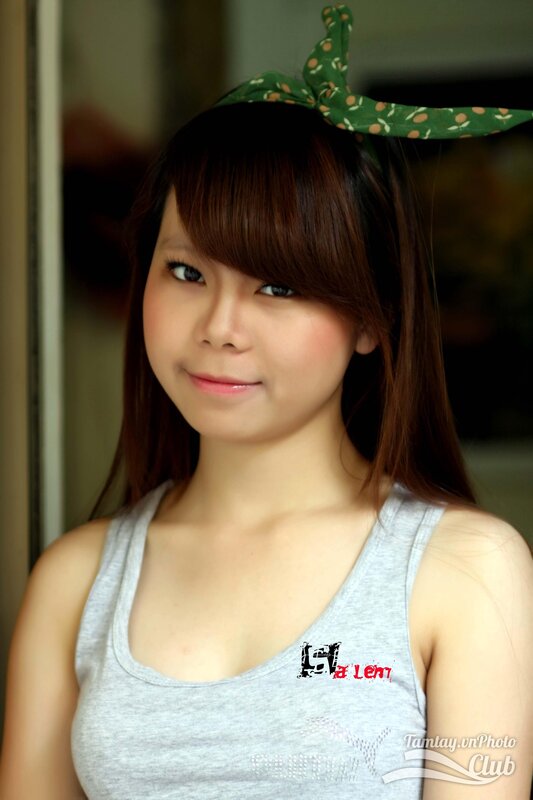 woman with headband smiling