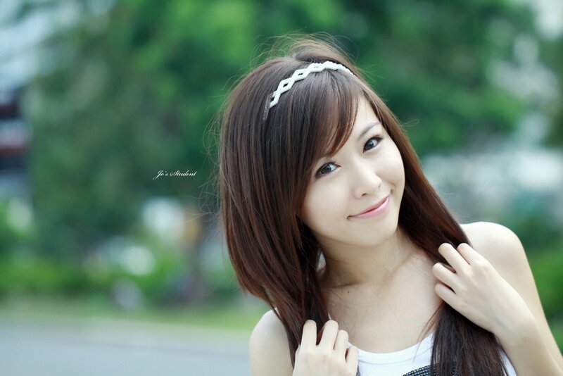 woman with headband smiling