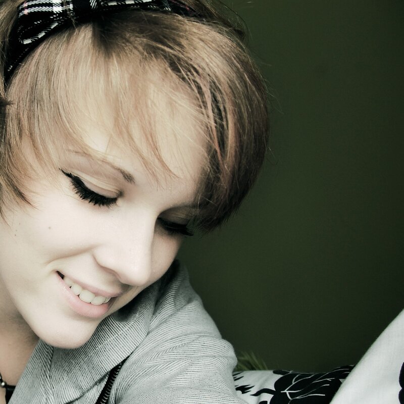 woman with headband smiling