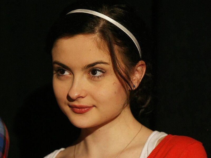 woman with headband smiling
