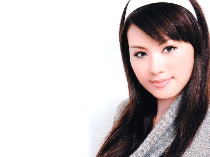 woman with headband smiling