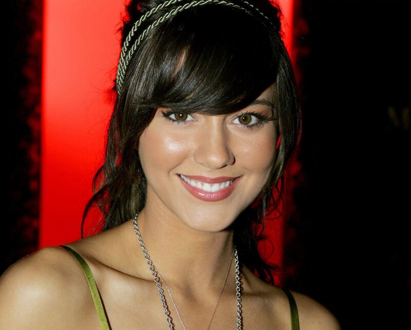 woman with headband smiling
