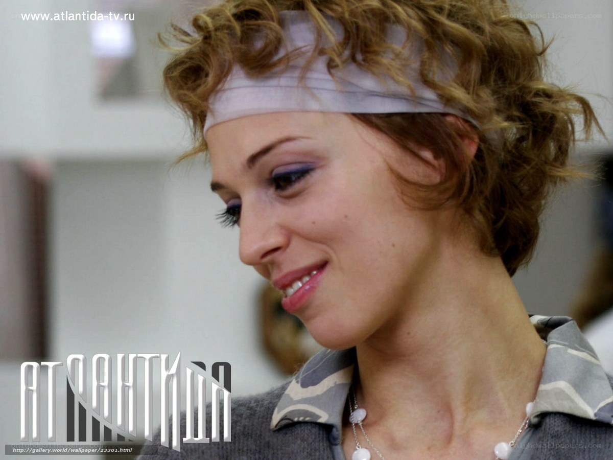 woman with headband smiling