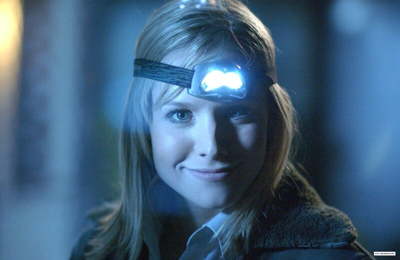 woman with headlamp in dark