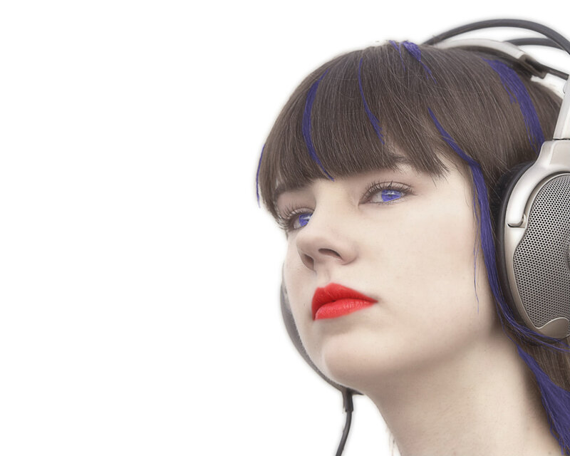 woman with headphones and blue hair