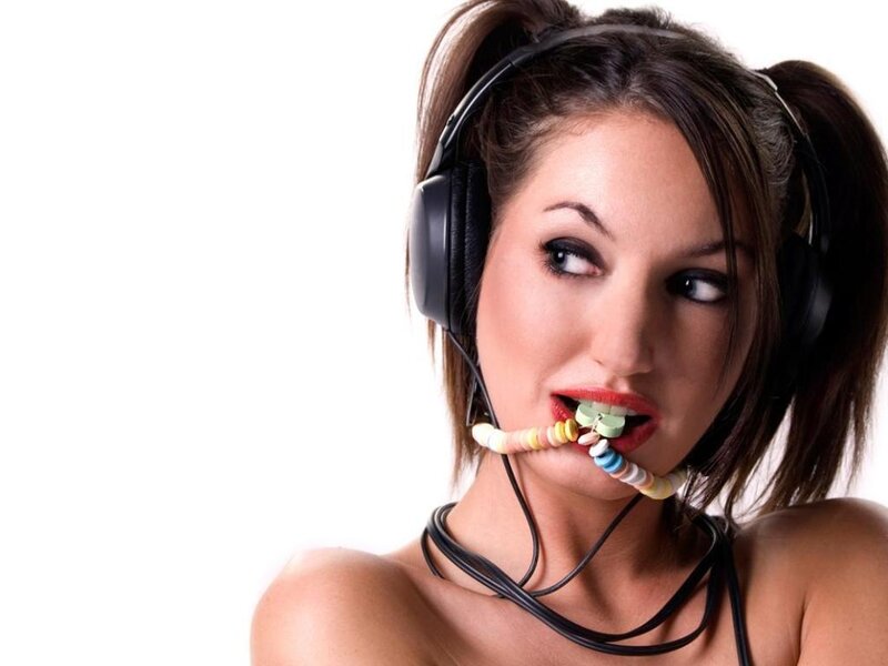 woman with headphones and candy
