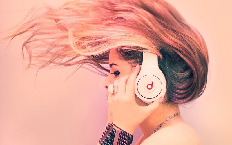 woman with headphones and flowing hair