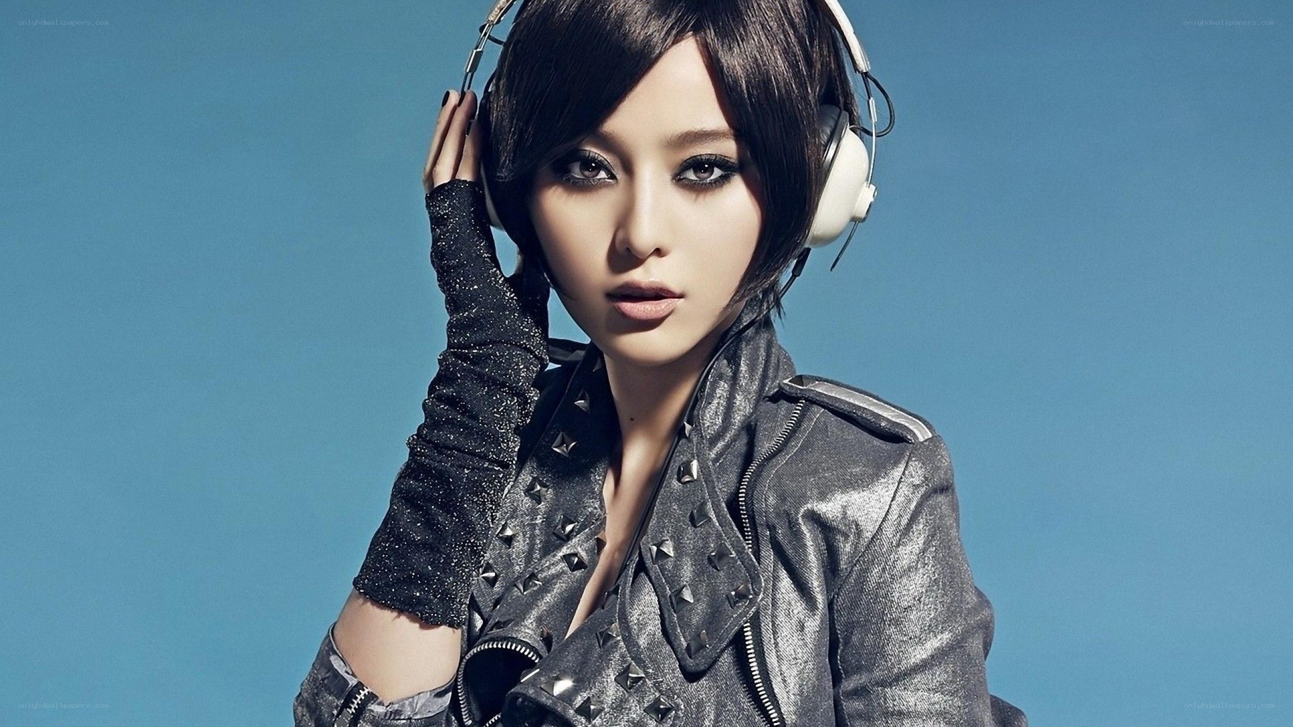 woman with headphones and jacket