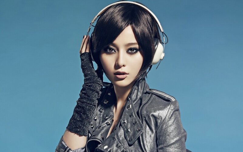 woman with headphones and leather jacket