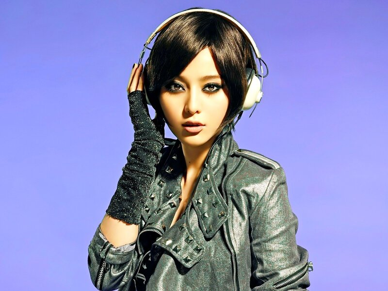 woman with headphones and leather jacket