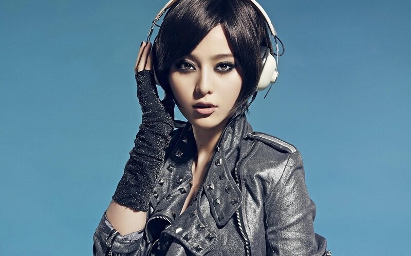 woman with headphones and leather jacket