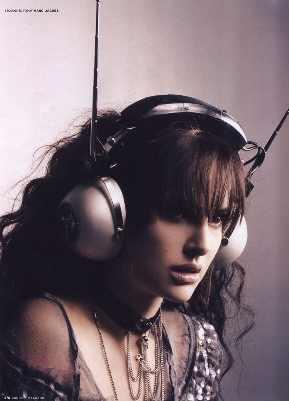 woman with headphones and sequins