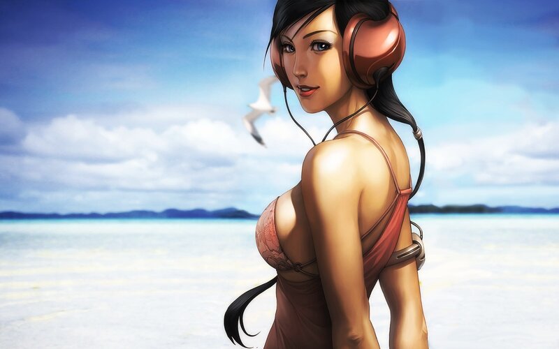 woman with headphones at beach