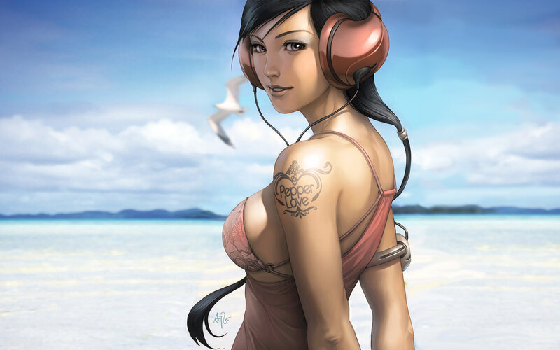 Woman with headphones at beach