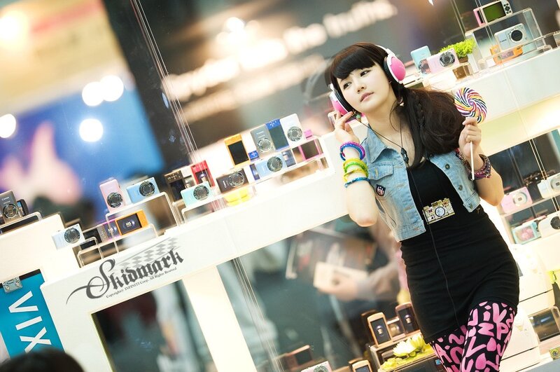 Woman with headphones at camera display