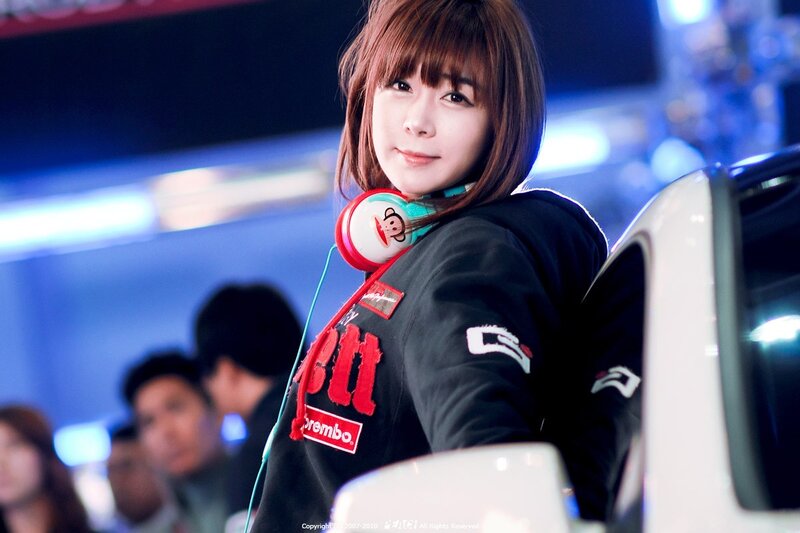 woman with headphones at event