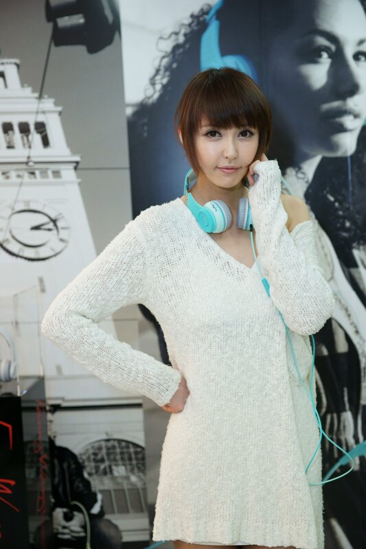 woman with headphones at event