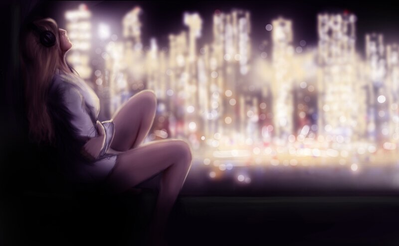 woman with headphones at night