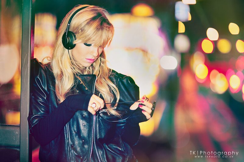 woman with headphones at night
