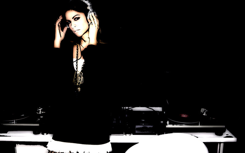woman with headphones at turntables