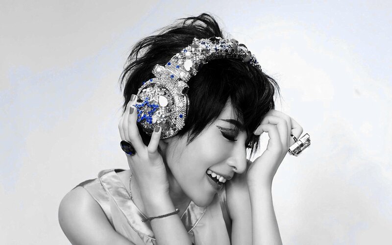 Woman with Headphones — Black, Playful, Photograph