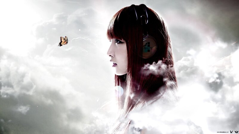 woman with headphones in clouds