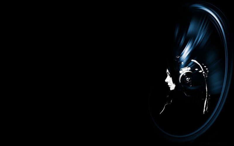 woman with headphones in dark
