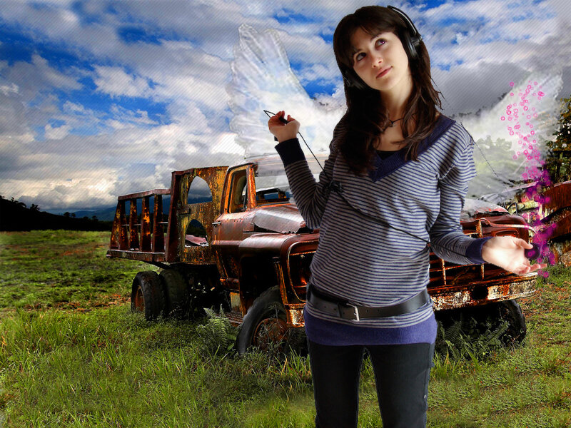 woman with headphones in field