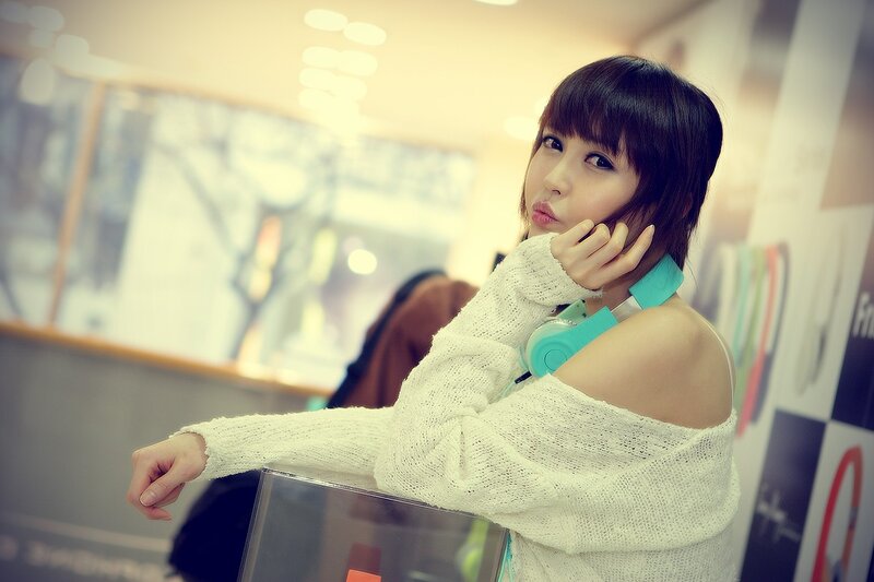 woman with headphones in store