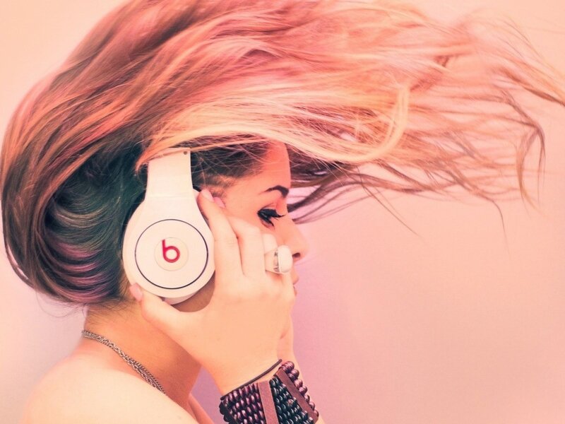woman with headphones in wind
