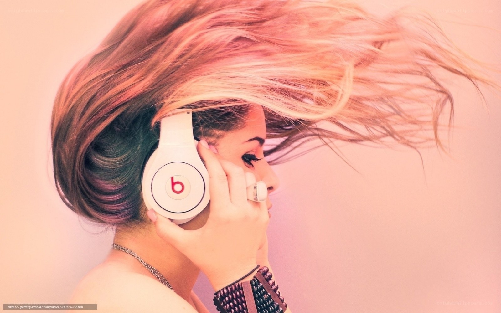 woman with headphones in wind