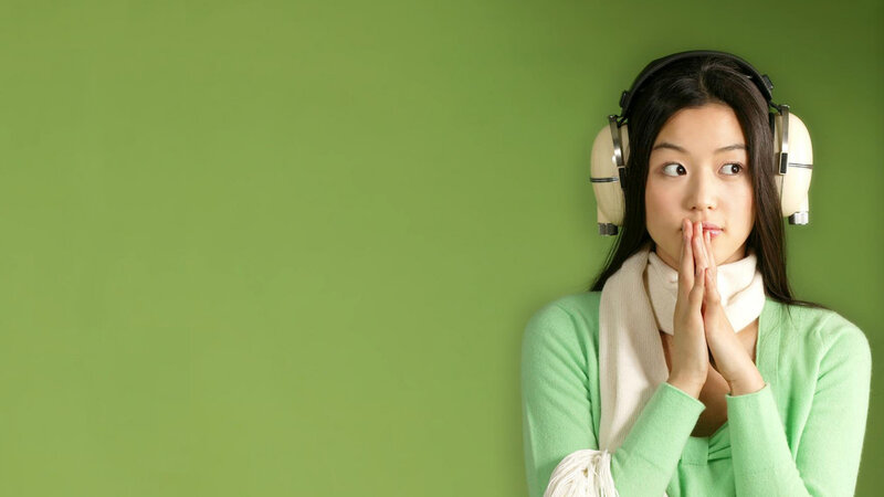 woman with headphones listening