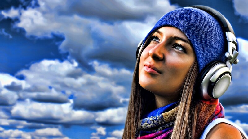 woman with headphones looking up