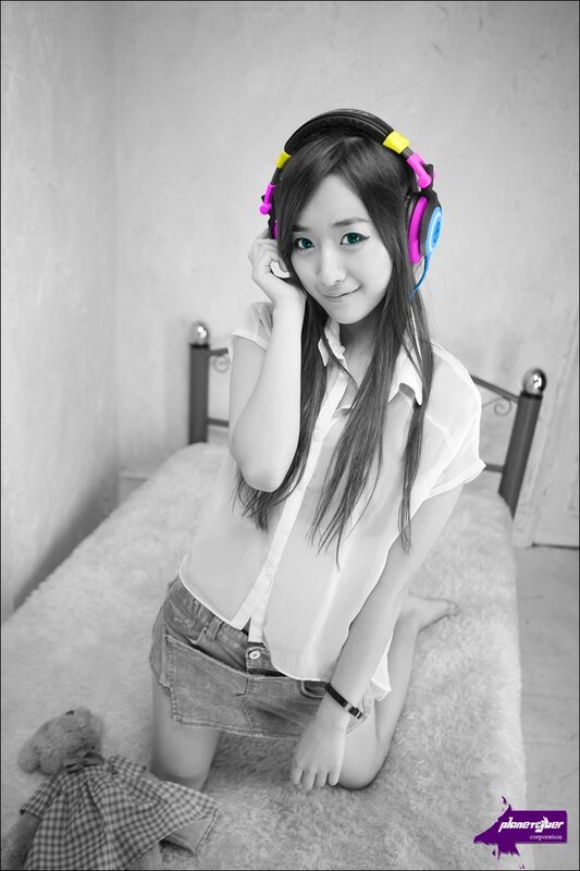 woman with headphones on bed