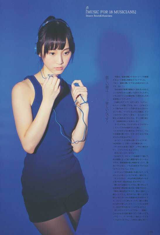 woman with headphones on blue background