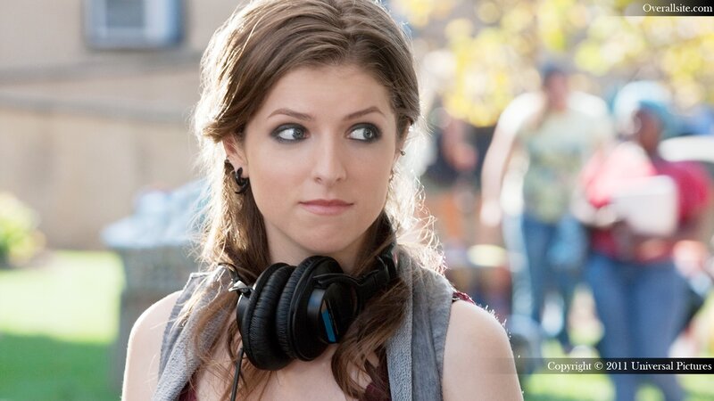 woman with headphones on campus