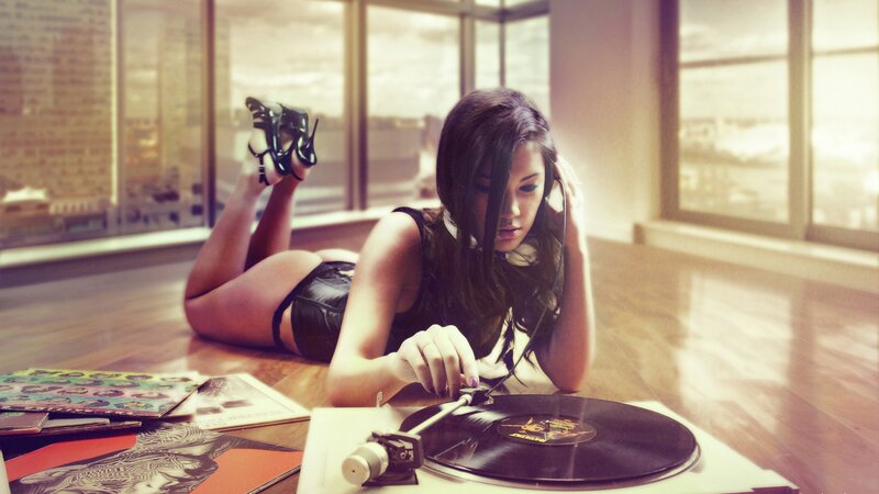 woman with headphones on floor